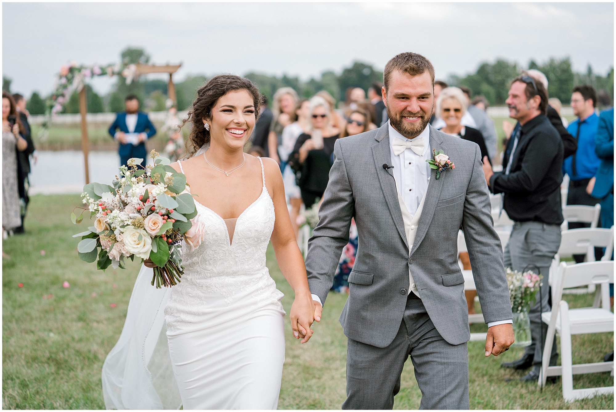 do you need a wedding planner? bride and groom walk down aisle