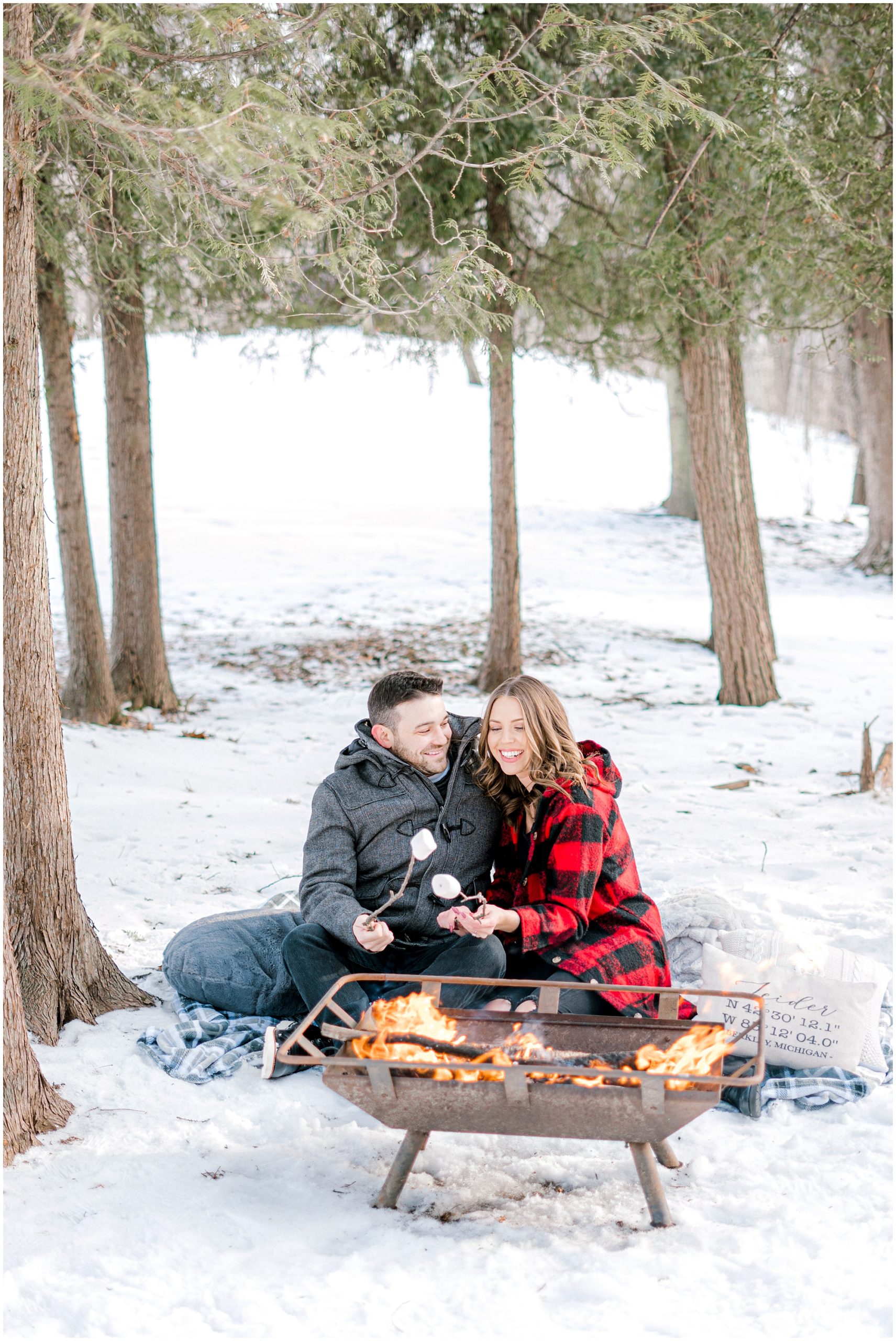 making smores in winter for engagement photos