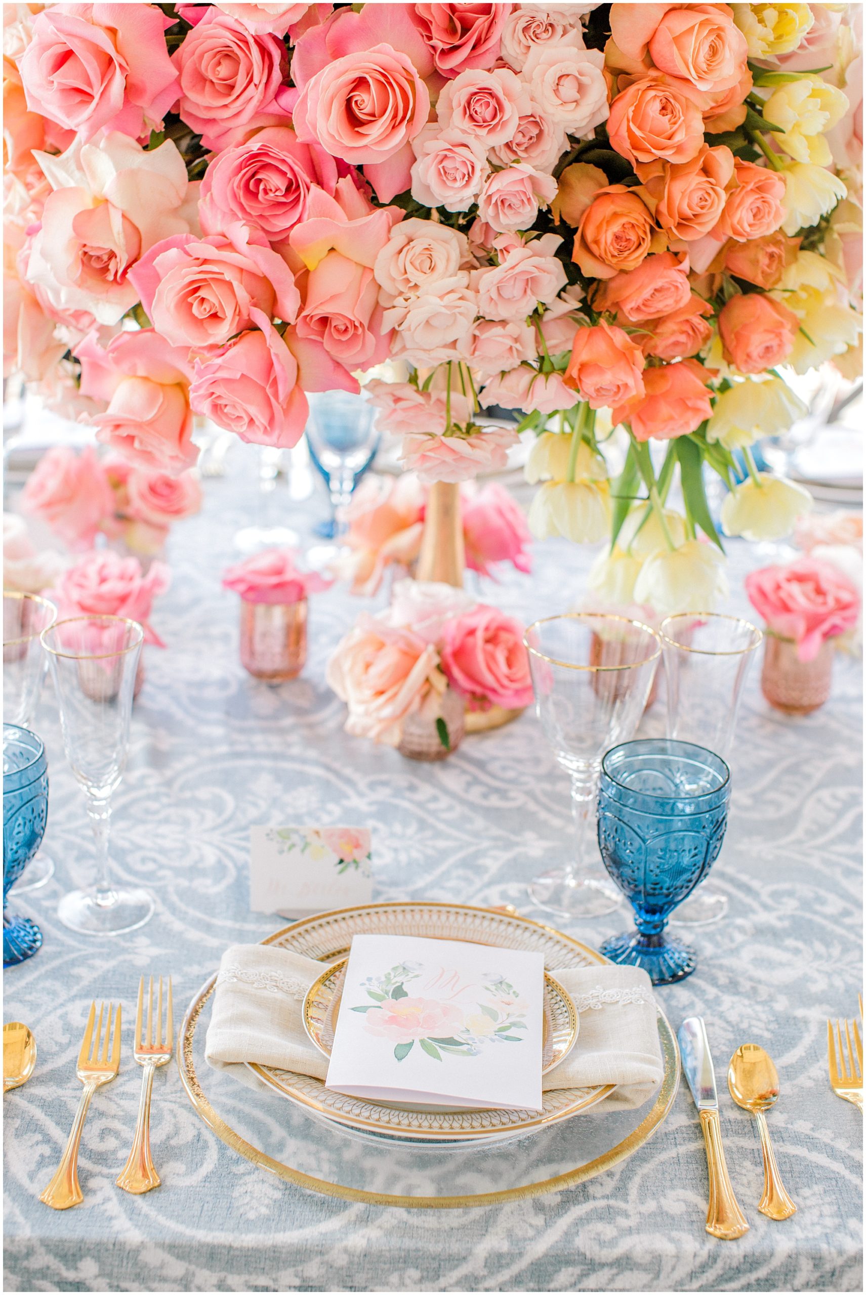 vintage glassware, floral menu cards, and a patterned wedding linen