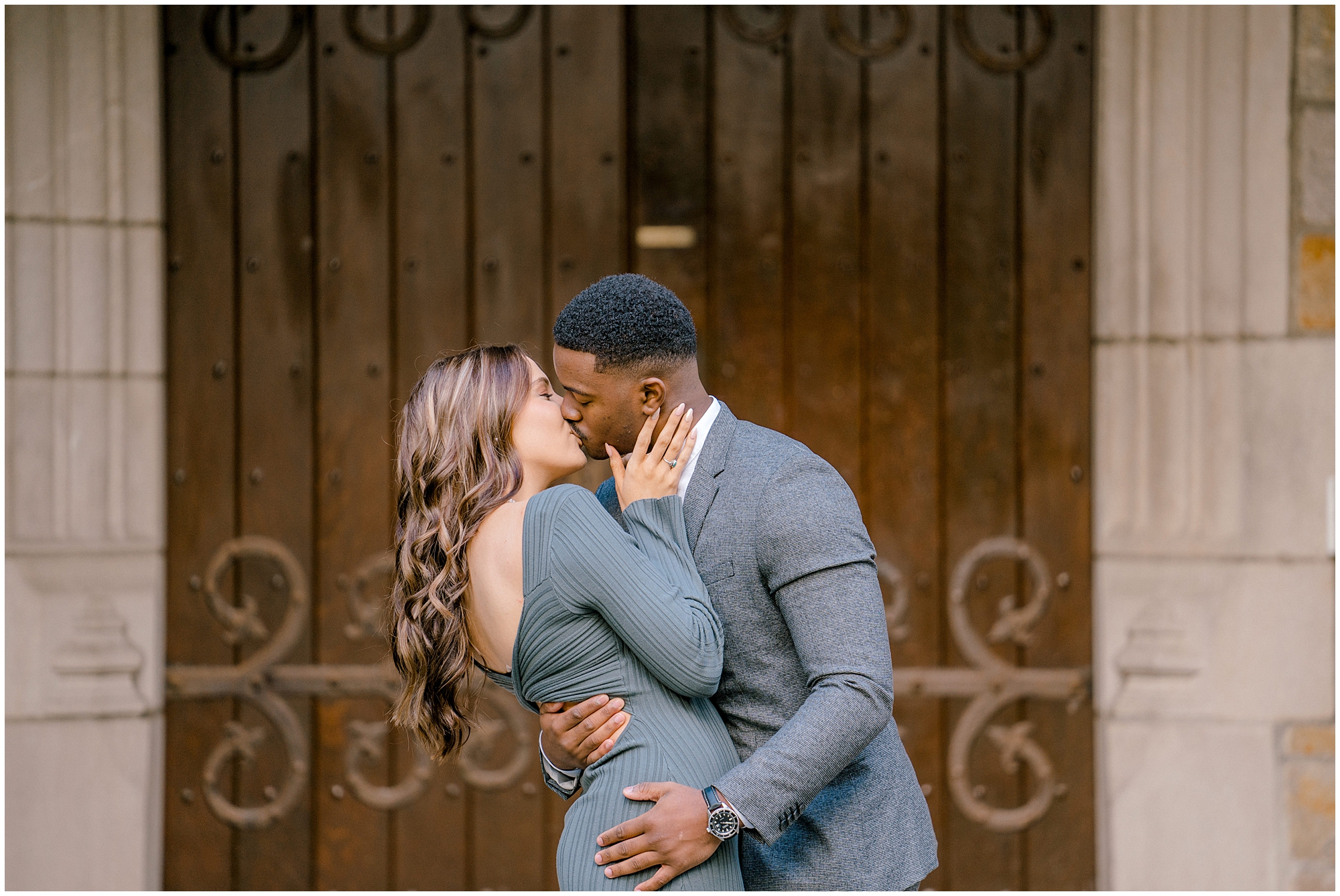 outdoor Detroit engagement photos of couple kissing