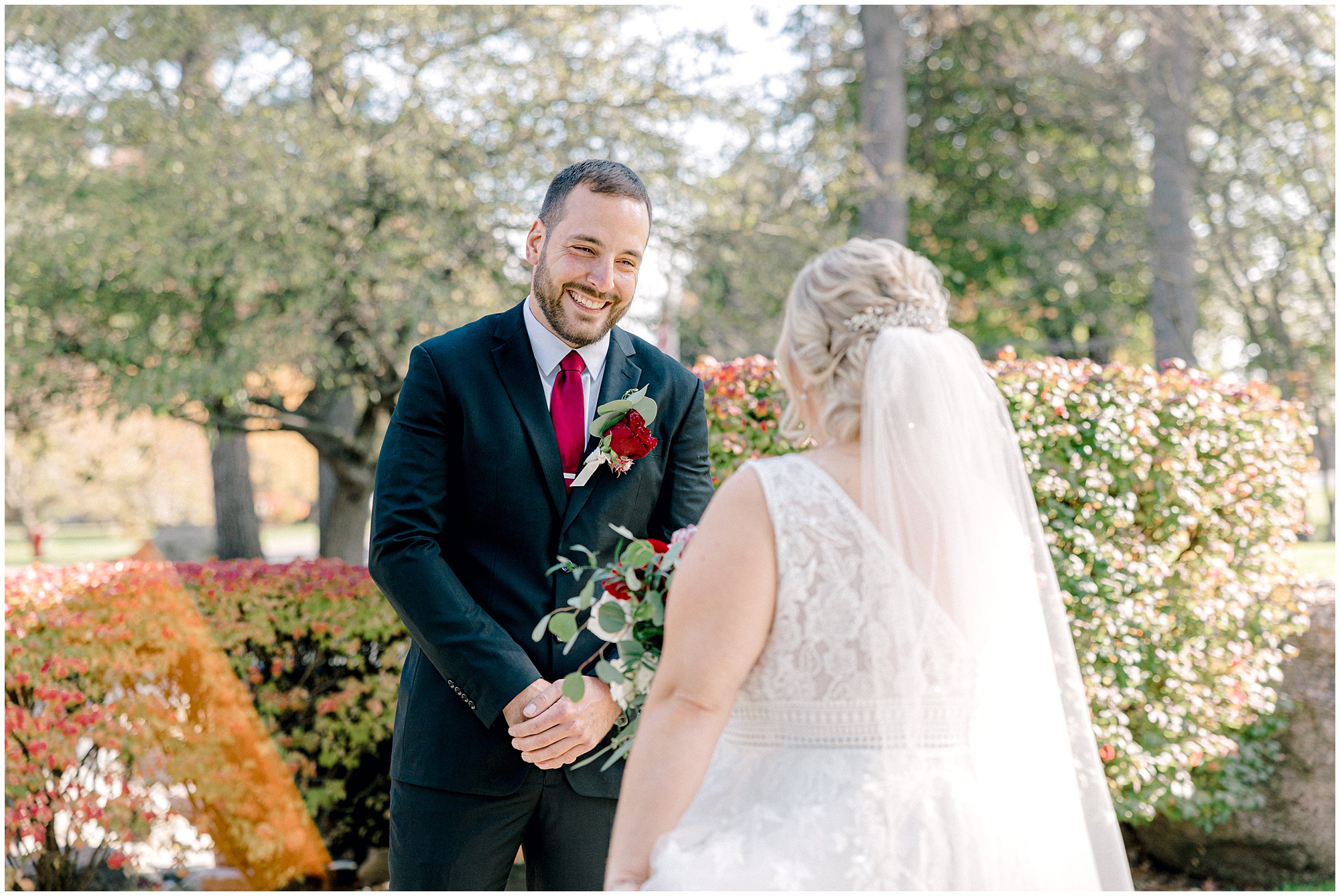 groom smiles during first look