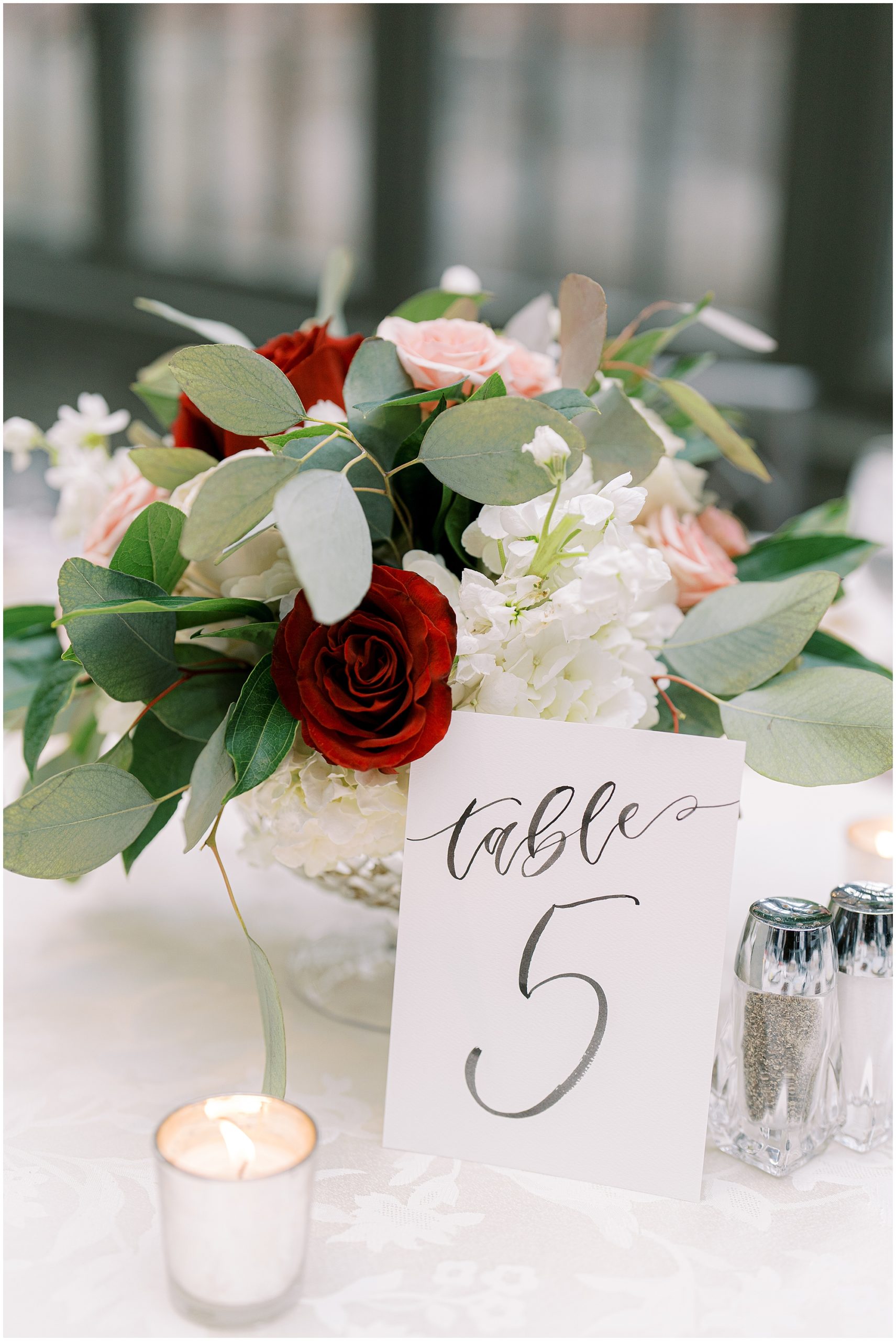 red roses in wedding reception table decor