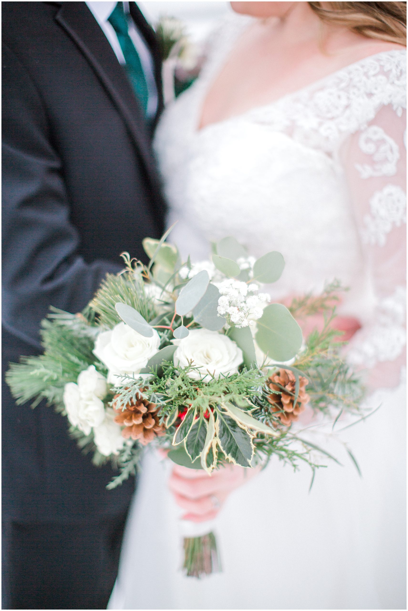 pinecones in bridal bouquet at winter wedding