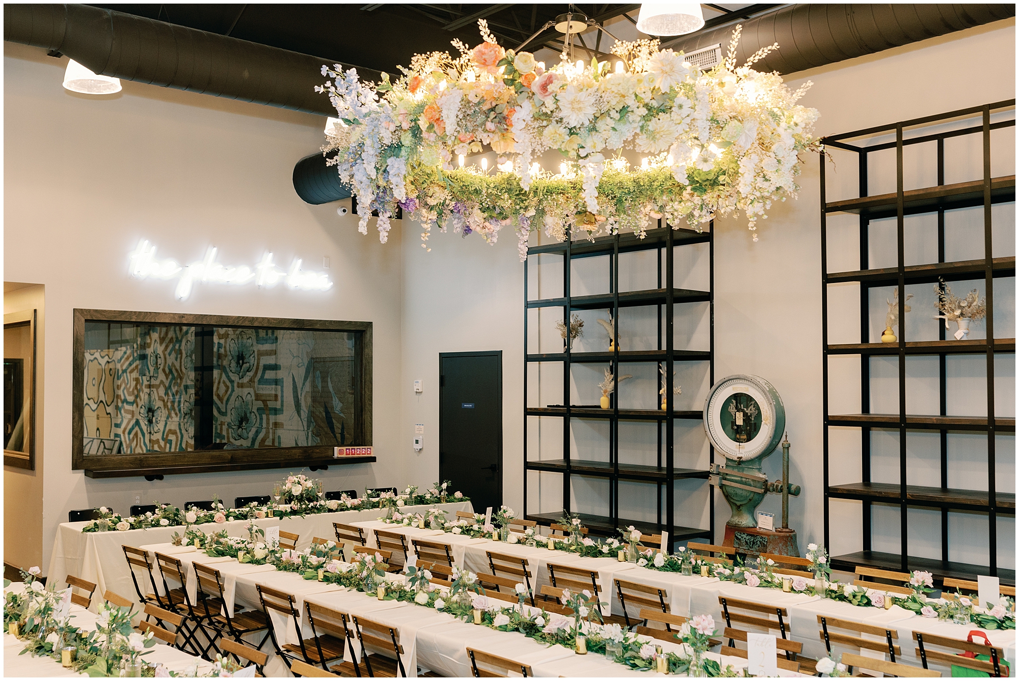 wedding reception decor with overhead floral chandelier