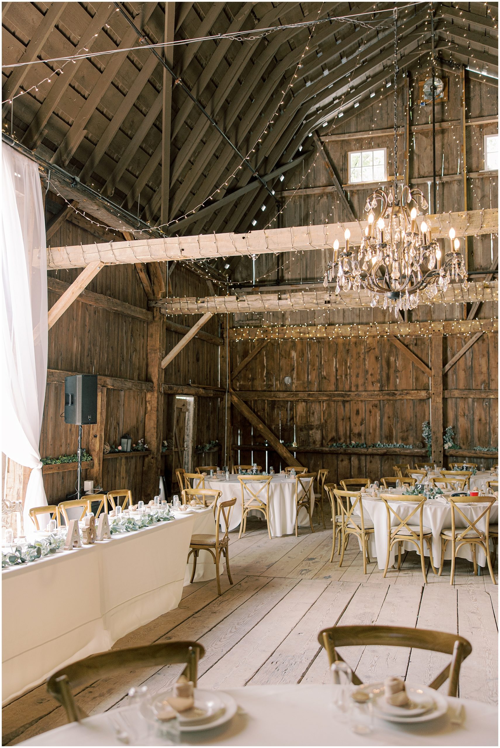 gorgeous indoor barn wedding venue with Chandelier