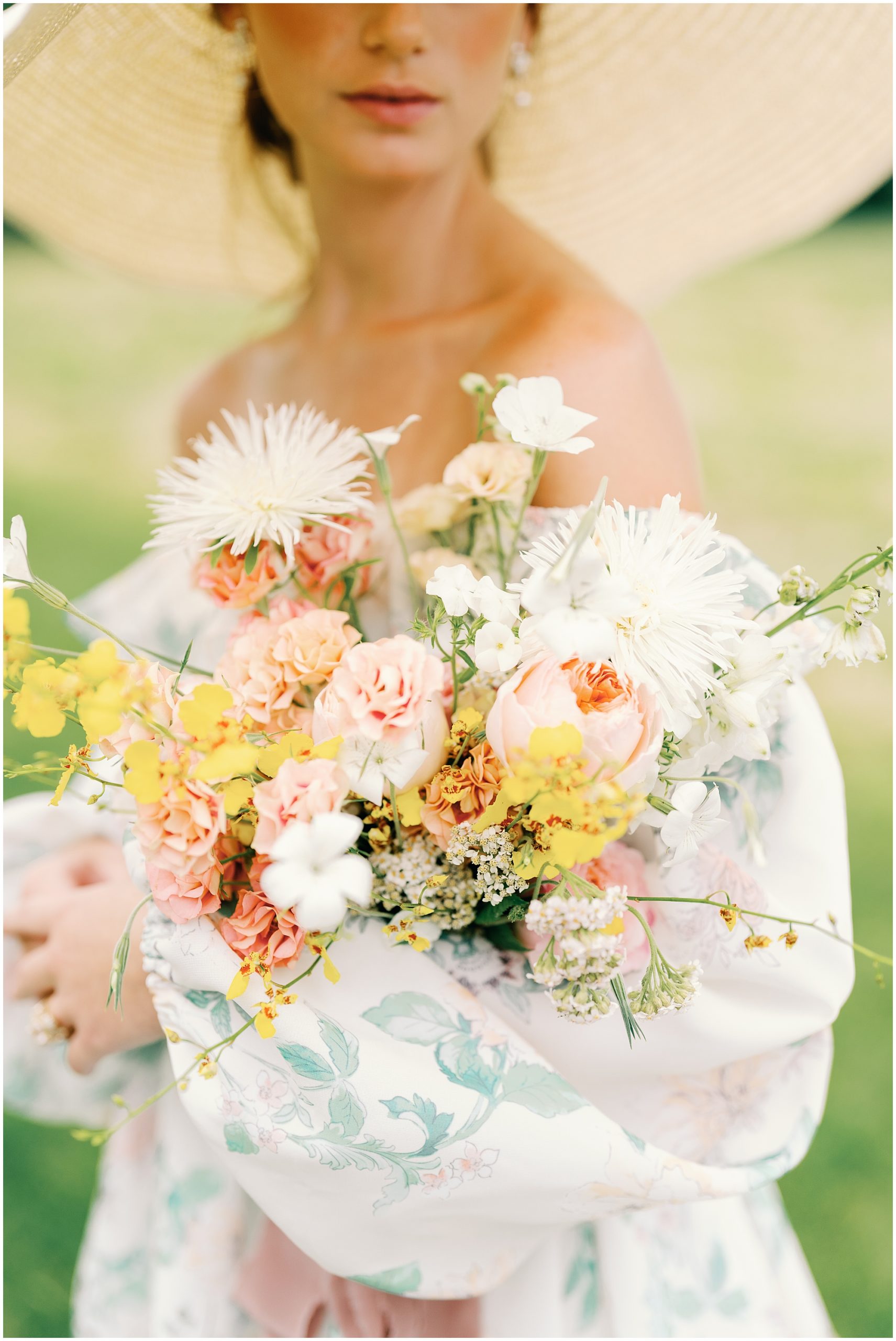 bride in floral flowy wedding dress with large wedding bouquet